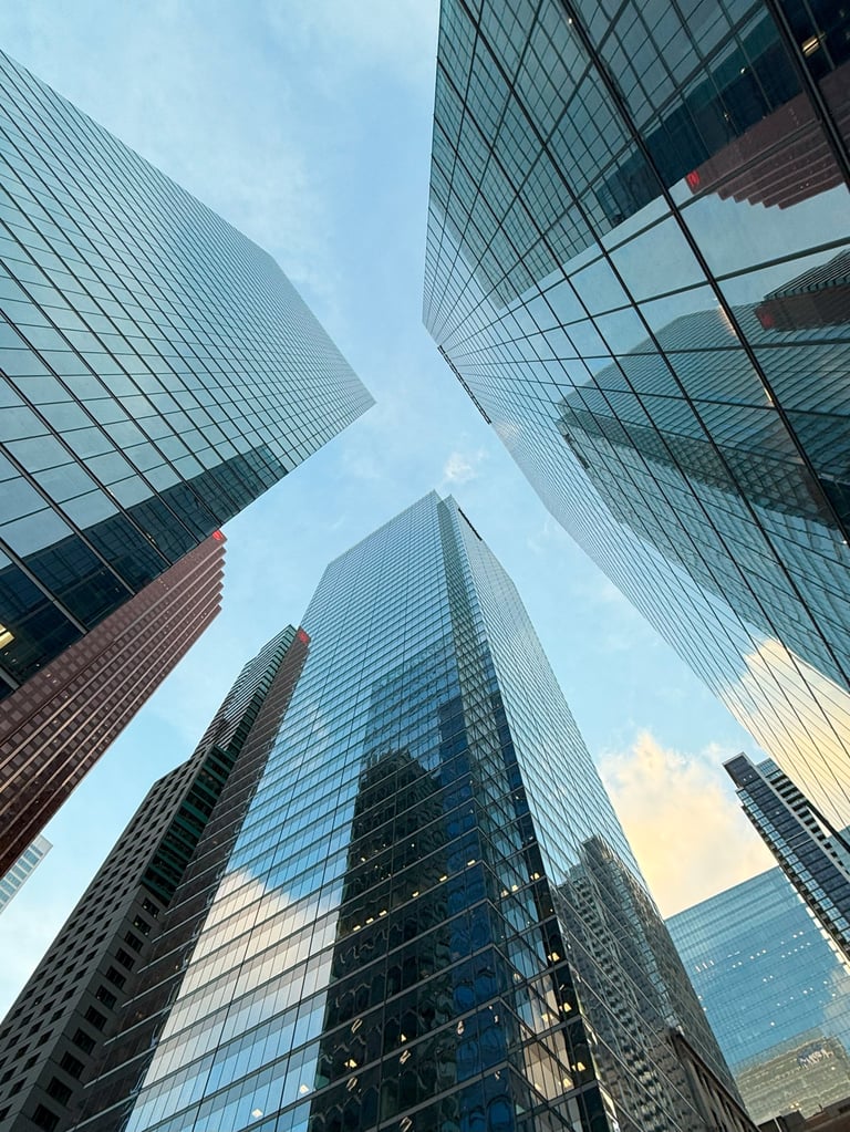 Modern glass office building representing business and corporate growth